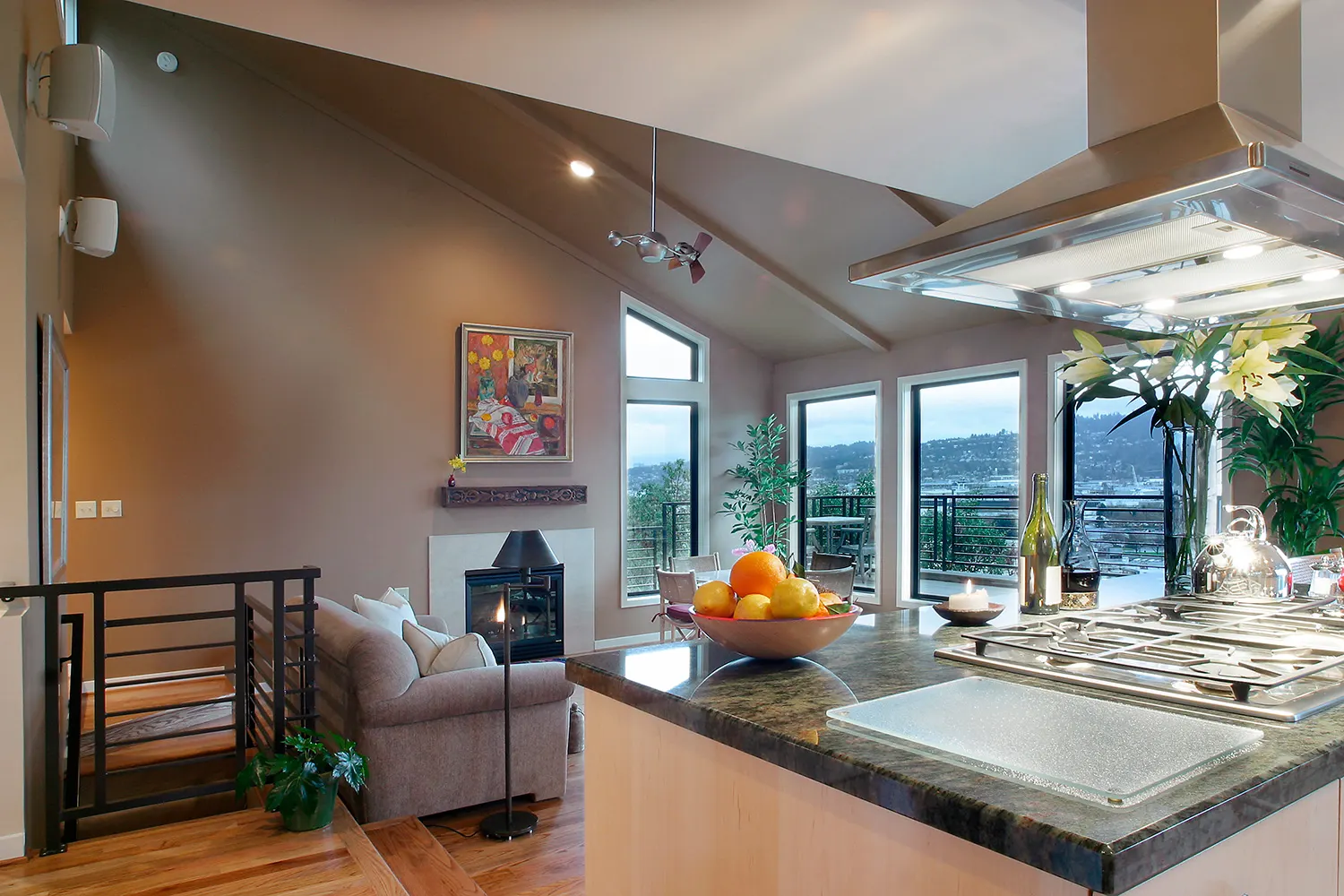 Wide-angle view of a luxury home remodeling project in Clark County, WA, featuring an open-concept kitchen island and sunken living room.