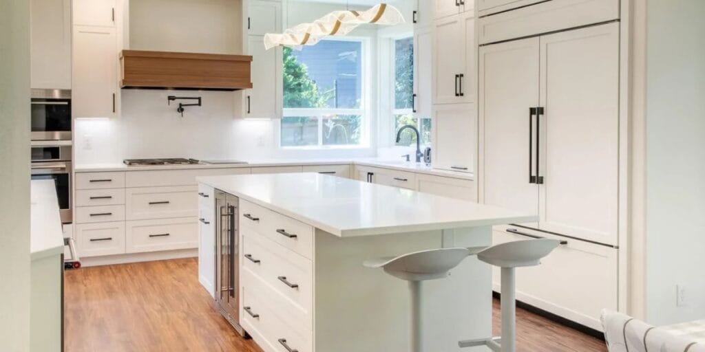 Bright open concept kitchen remodel featuring a spacious island, custom cabinetry, and seamless flow into the living area | Open Concept Kitchen Remodel